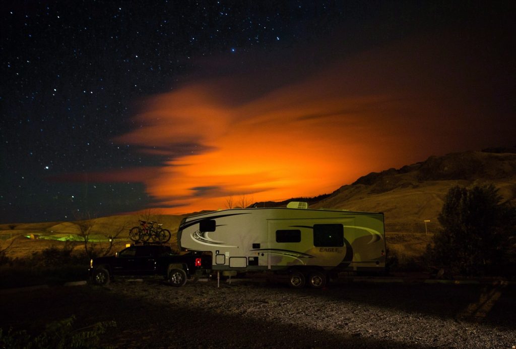 A photo of a wildfire in B.C. has a trailer burning in B.C. in 2017