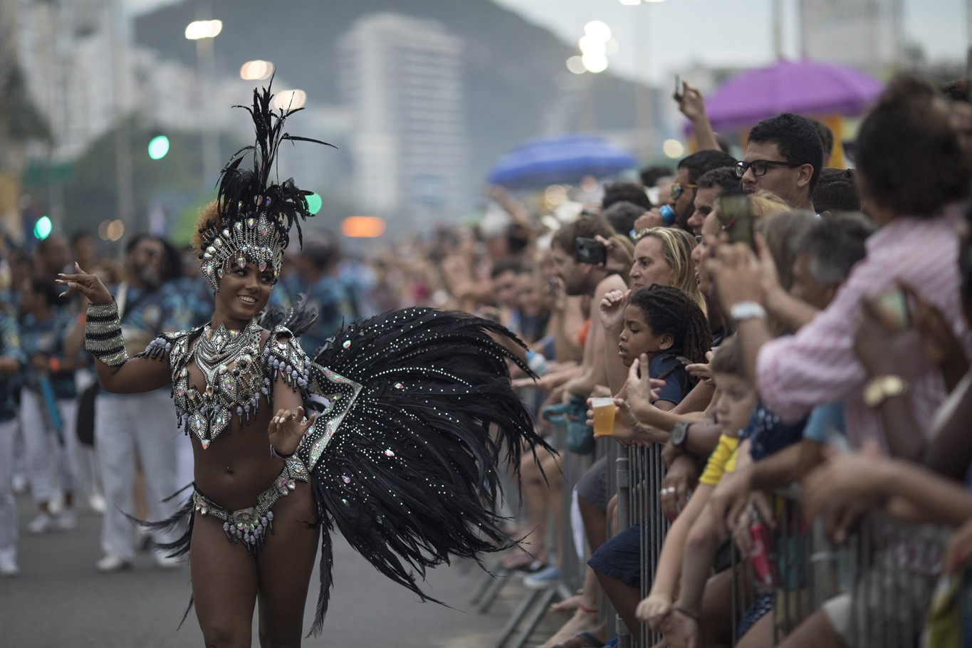 A member of a samba school parades along Copacabana Beach in Rio de Janeiro...