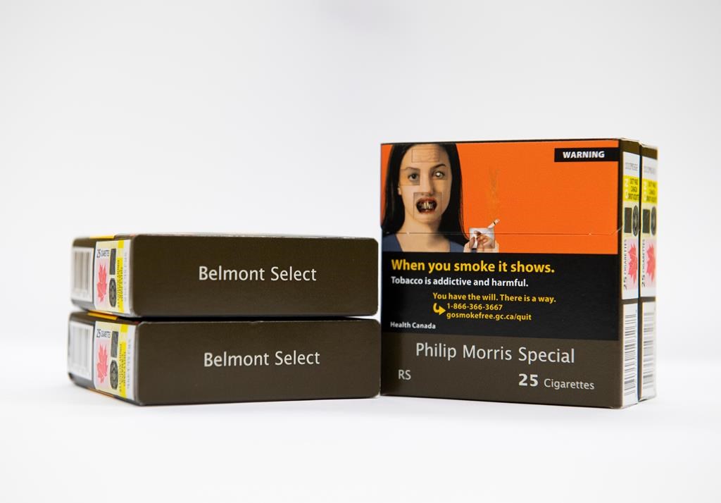 Cigarette packs with warning labels and images