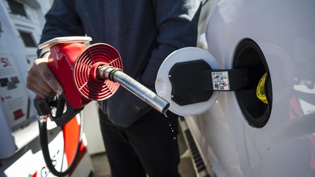 A man fills up his truck with gas in Toronto on April 1, 2019. THE CANADIAN PRESS/Christopher Katsarov