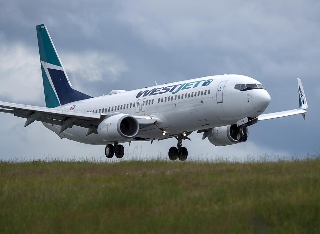 A WestJet flight from Calgary arrives at Halifax Stanfield International Airport in Enfield, N.S. on Monday, July 6, 2020.  THE CANADIAN PRESS/Andrew Vaughan