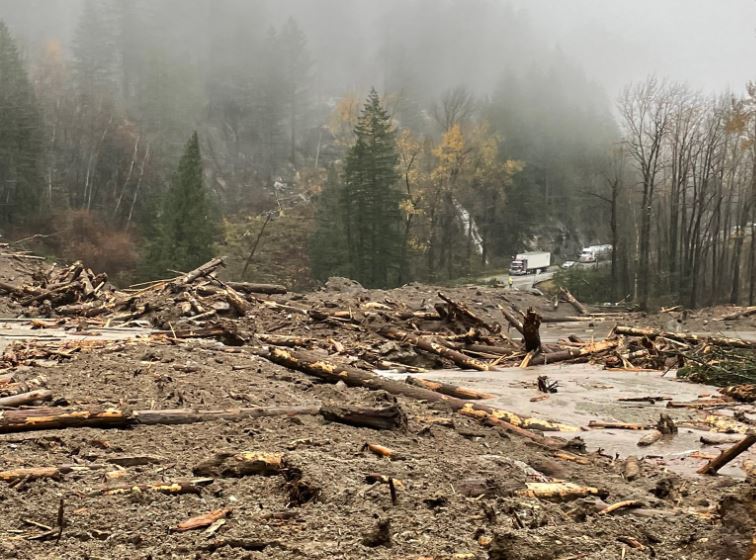 Mud, trees, and other debris fill a B.C. highway in a mountainous and forested area between Agassiz and Hope