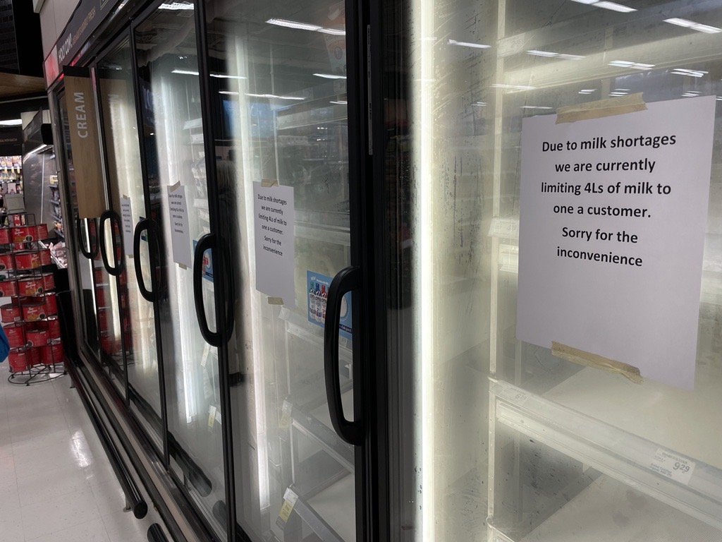 A sign at a grocery store details B.C.'s milk shortage impacts on consumers