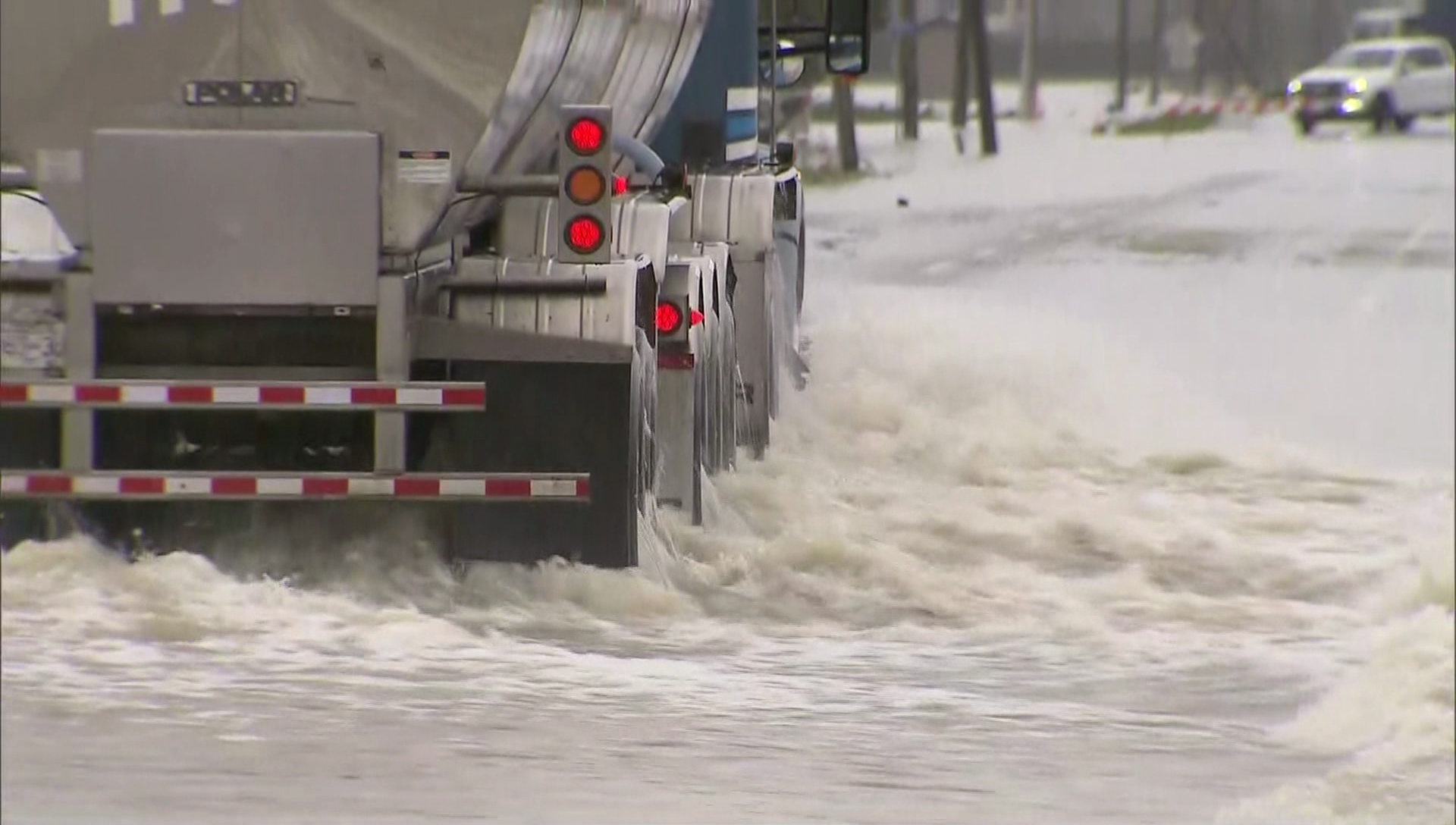 A truck drives through flooded roads in Abbotsford, B.C. on Tuesday, Nov. 30, 2021