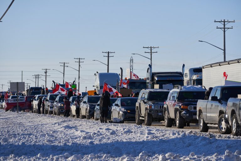 Massive trucking convoy heading to Ottawa, organizers say they want to topple government