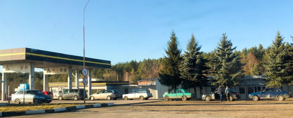 Pictures taken near Lviv, Ukraine as showing a long line at a gas station as people try to flee the western city to the border