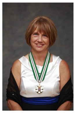 Crystal Dunahee, Michael Dunahee's mother, sits with the Order of BC medal around her neck