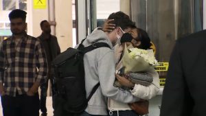 Families greet each other at YVR