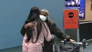 Families greet each other at YVR