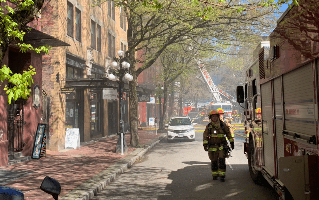 Vancouver firefighters douse flames at the Winters Hotel in Gastown