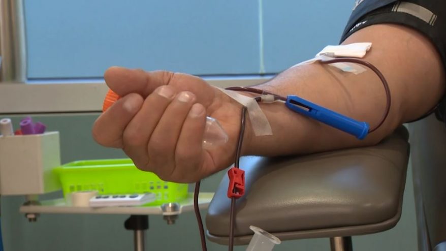 A person gives blood. 