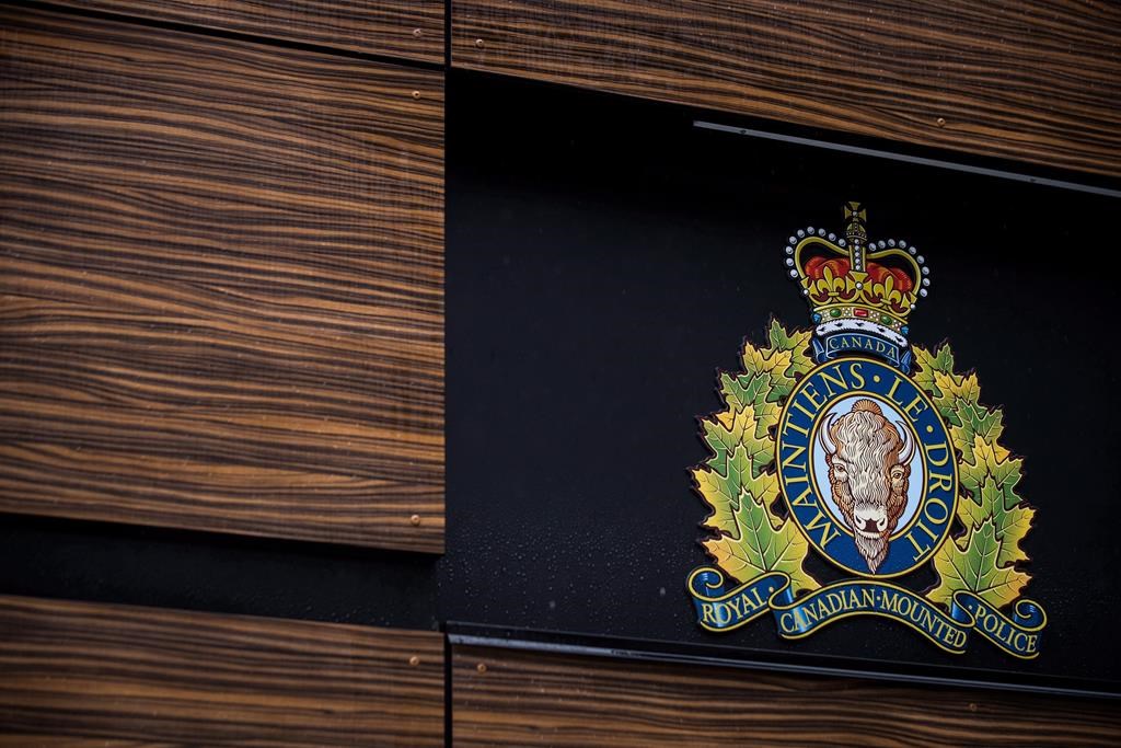 The RCMP logo is seen outside Royal Canadian Mounted Police "E" Division Headquarters, in Surrey