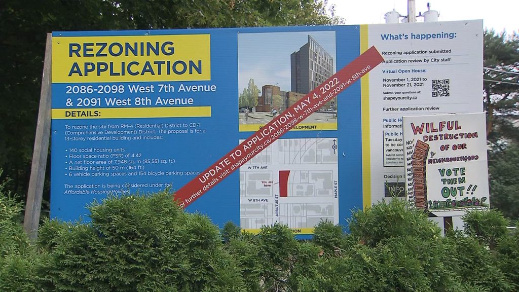 A rezoning application sign is posted at a lot in Vancouver