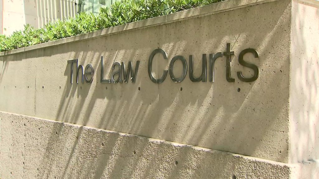 A sign that reads 'The Law Courts' in downtown Vancouver