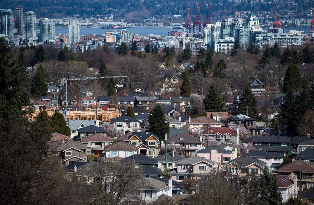Homes are seen with the City of Vancouver in the background