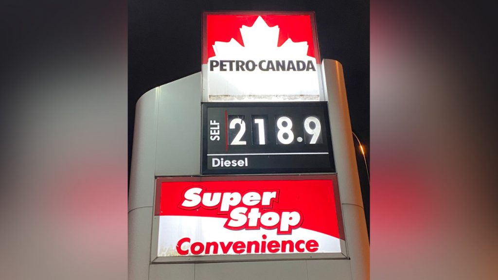 An image showing a gas station sign posting a litre of regular for 218.9