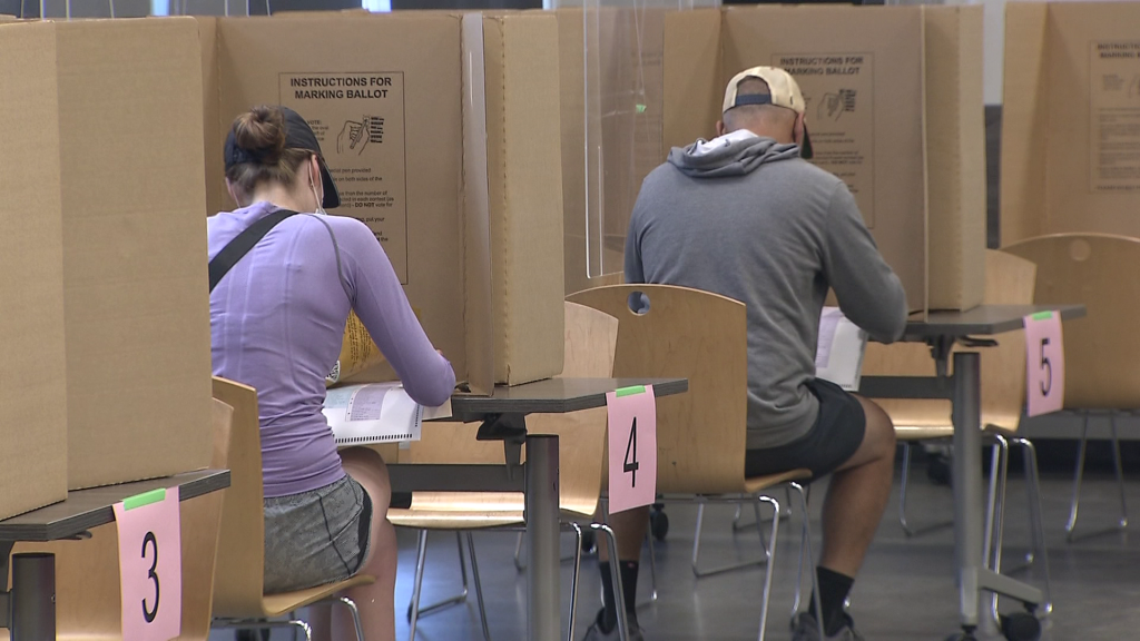 People cast ballots in the advance polls of the 2022 B.C. municipal elections