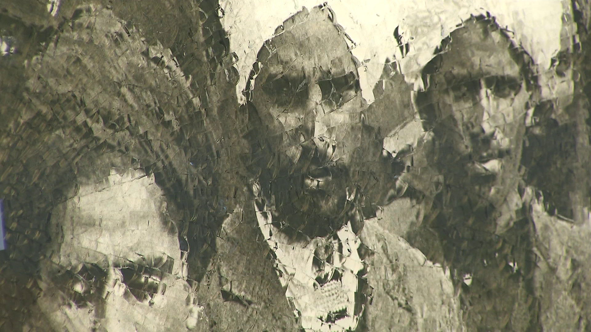 A glass memorial with the photo of a group from the Komagata Maru ship