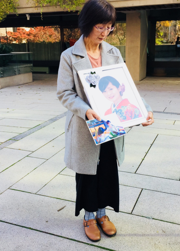 Natsumi Kogawa mother The mother of Natsumi Kogawa, a Japanese student who was killed in 2016 and whose body was found in a suitcase at a vacant Vancouver mansion, holds up a photo of her daughter at the trial of William Schneider