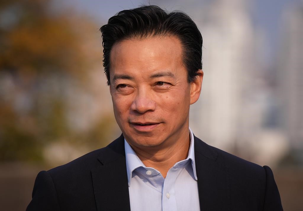 Vancouver mayor-elect Ken Sim arrives for a news conference in Vancouver