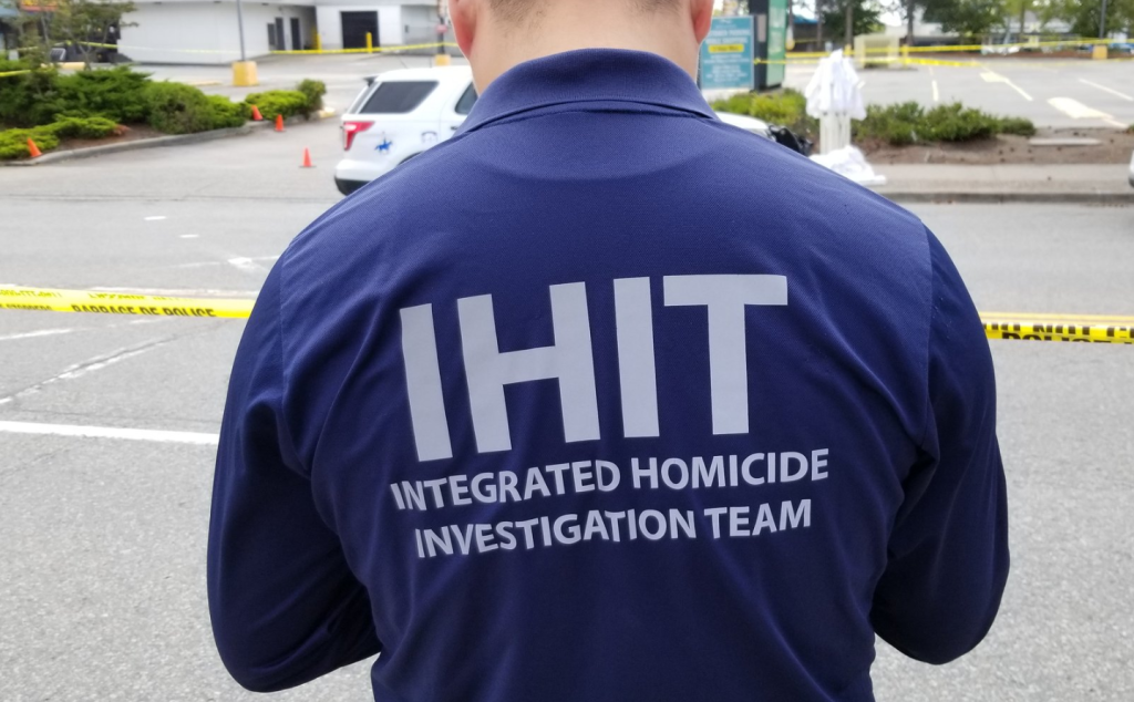 The back of an IHIT investigator wearing a labelled jacket