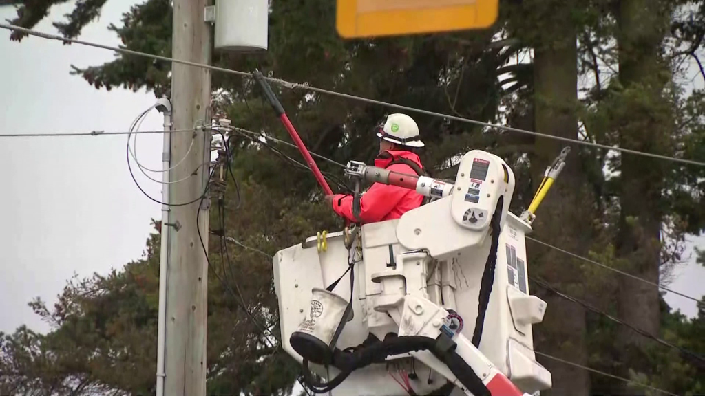 BC Hydro Linesman works on a power line