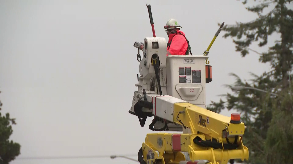 BC Hydro Linesman works on a power line