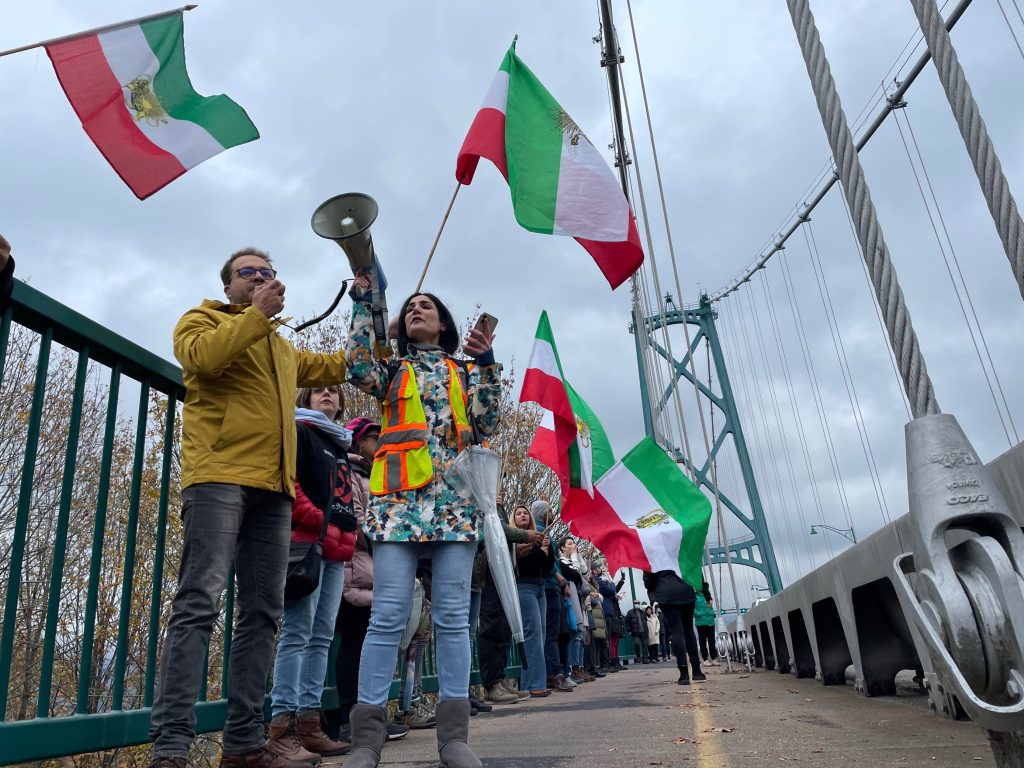 Hundreds of demonstrators lined up along the Lions Gate Bridge into the Stanley Park Causeway Saturday calling for an end of the Iranian regime