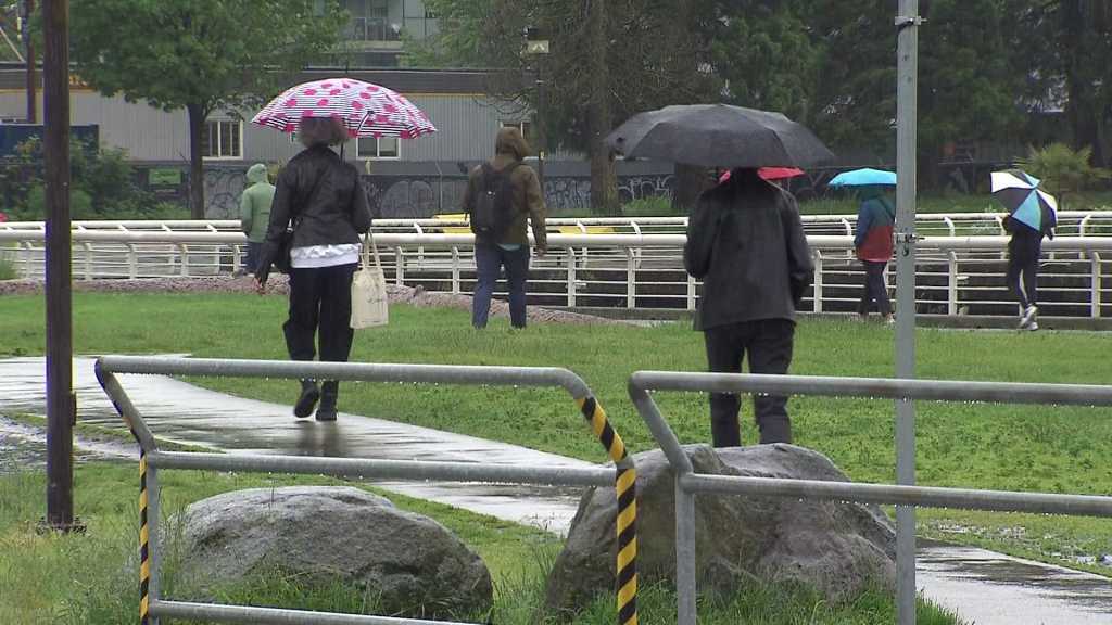 People walking with umbrellas. Another atmospheric river is set to hit B.C.'s south coast on Thursday.