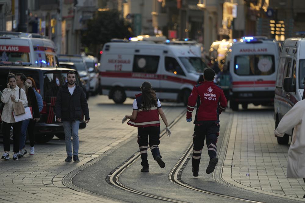 Security and ambulances at the scene after an explosion on Istanbul's popular pedestrian Istiklal Avenue, Sunday, Nov. 13, 2022. Istanbul Gov. Ali Yerlikaya tweeted that the explosion occurred at about 4:20 p.m. (1320 GMT) and that there were deaths and injuries, but he did not say how many. The cause of the explosion was not clear