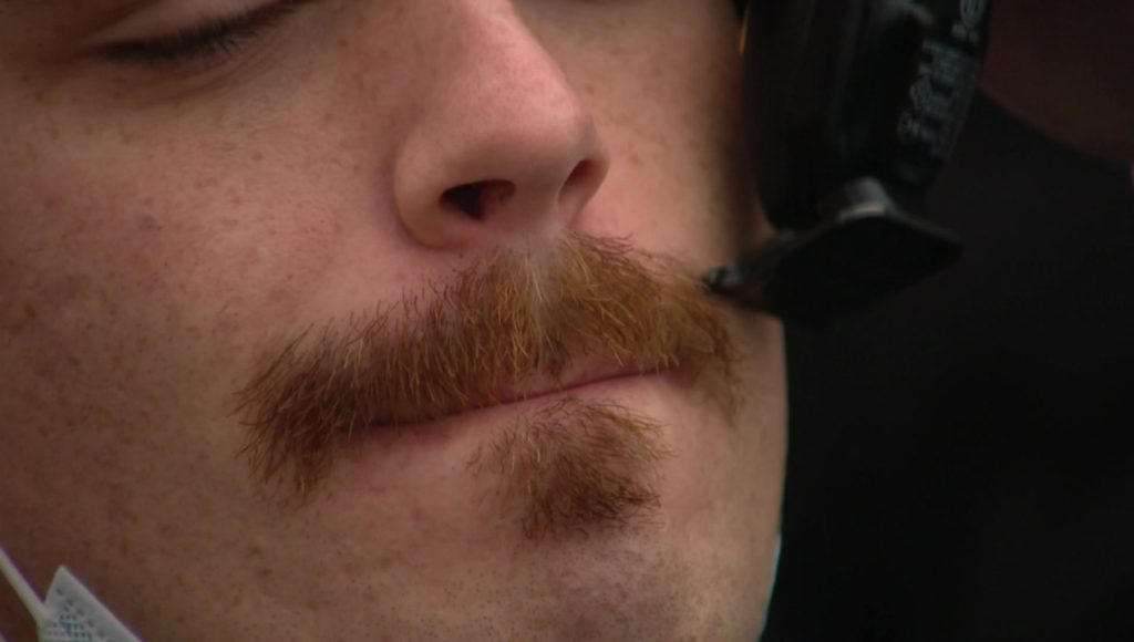 A close up of a Movember moustache that is being tended to