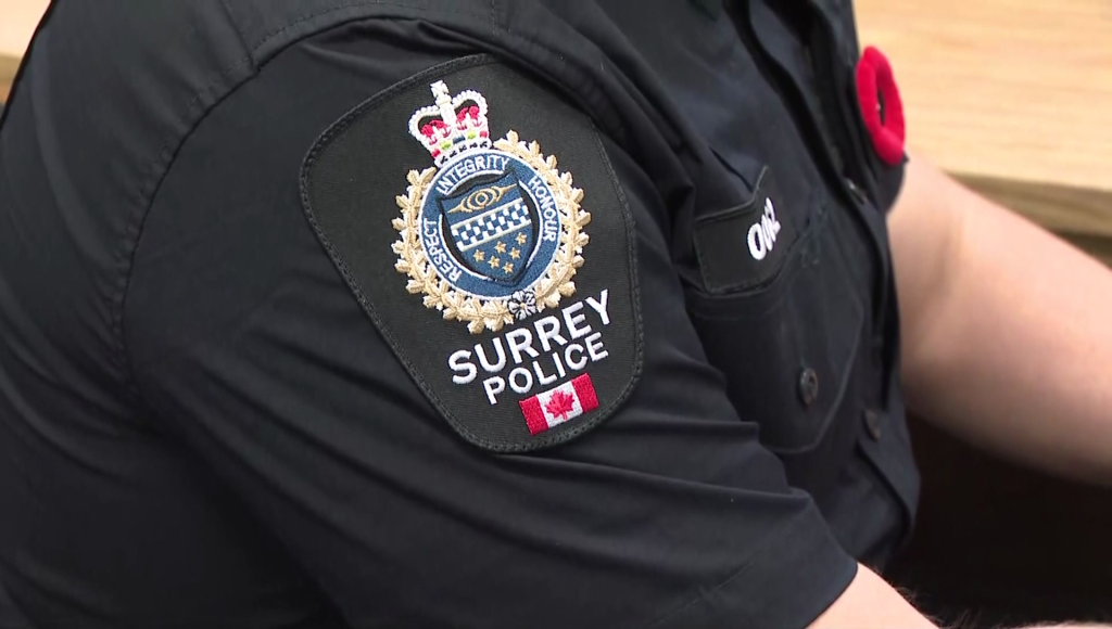The shoulder badge of a Surrey Police Service officer