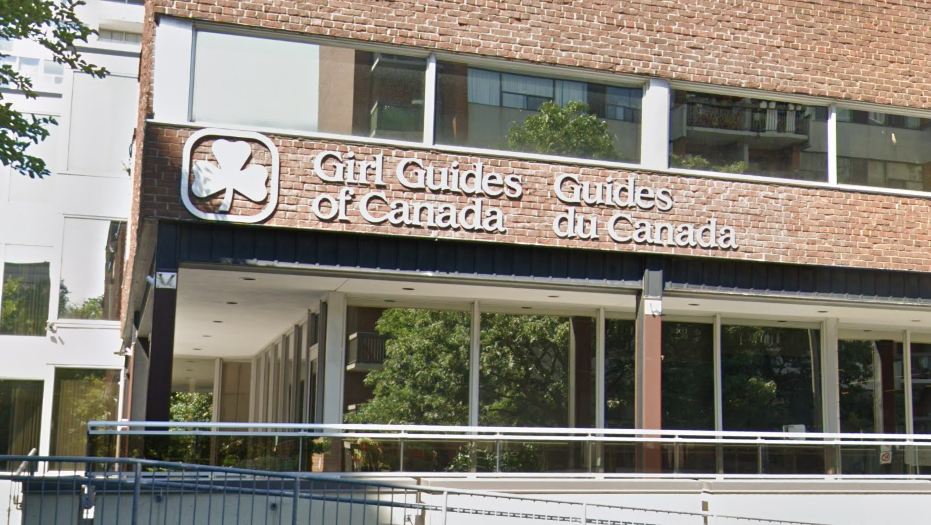The Girl Guides of Canada logo on a building