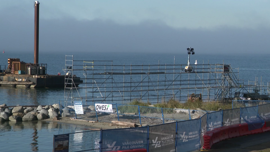 Beach and park with a construction site in the distance