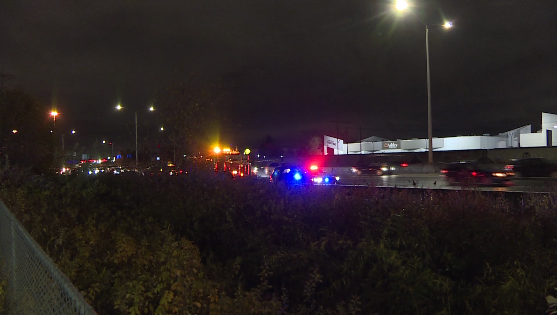 Police cruisers on a dark highway