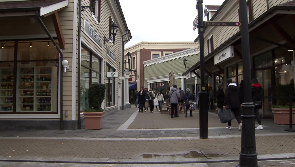 Black Friday shoppers outside a store at McArthur Glen Designer Outlets