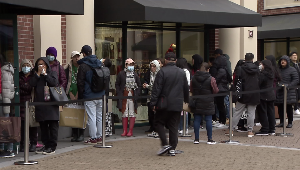 Black Friday shoppers outside a store at McArthur Glen Designer Outlets