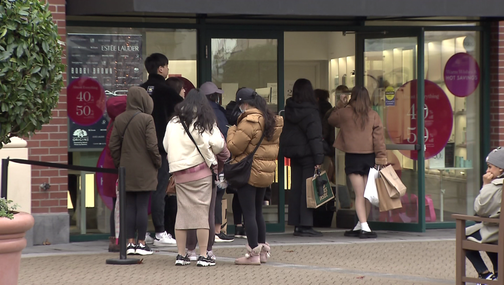 Black Friday shoppers outside a store at McArthur Glen Designer Outlets