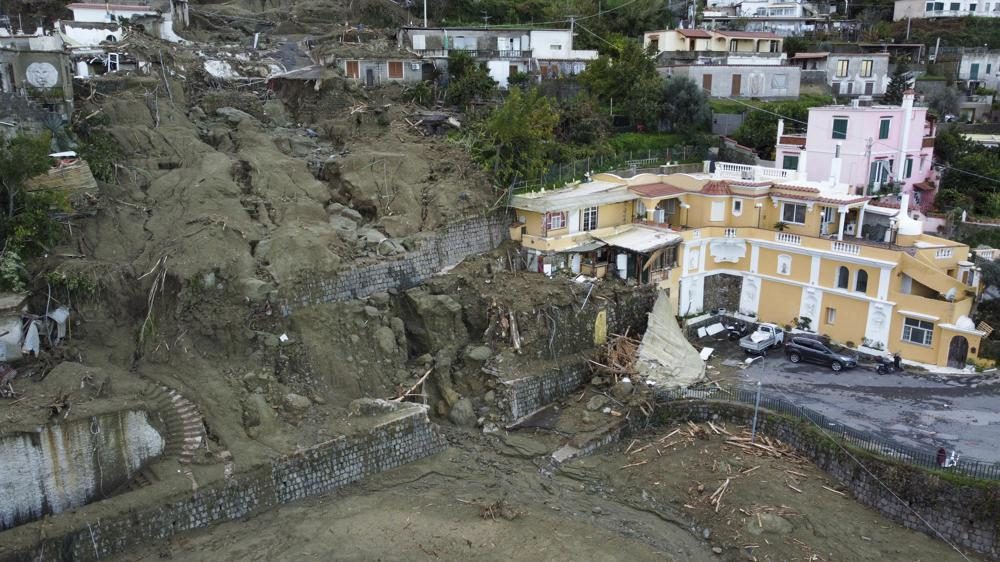 An aerial view of damaged houses after heavy rainfall triggered landslides that collapsed buildings and left as many as 12 people missing, in Casamicciola, on the southern Italian island of Ischia, Sunday, Nov. 27, 2022.