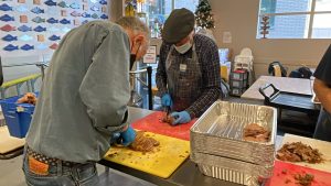 cutting up cooked food