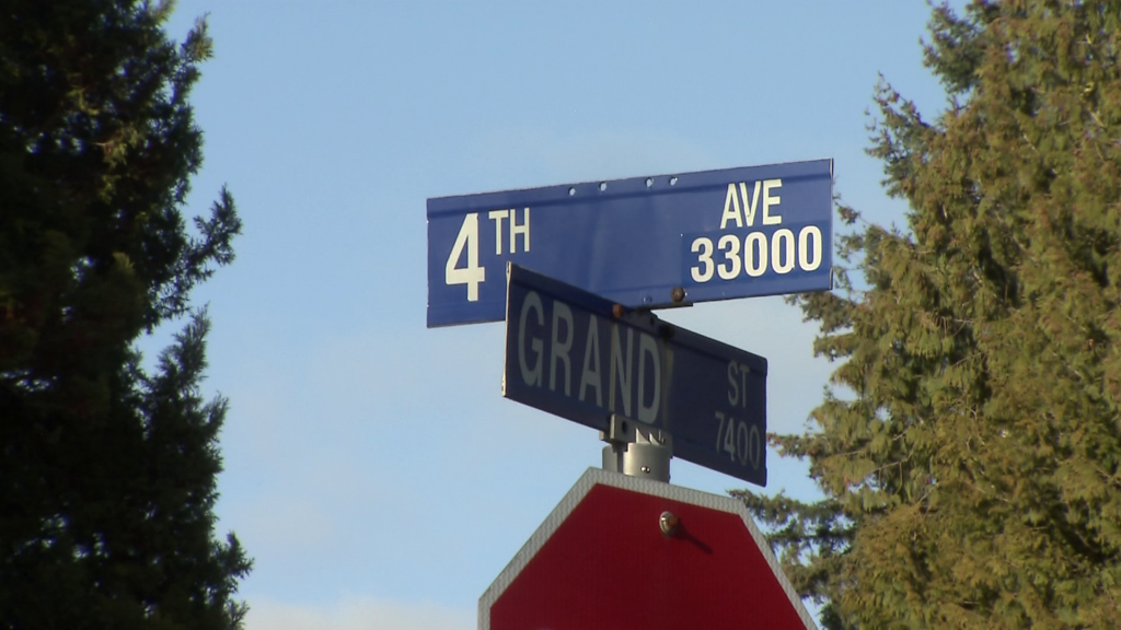4th Avenue at Grand Street sign