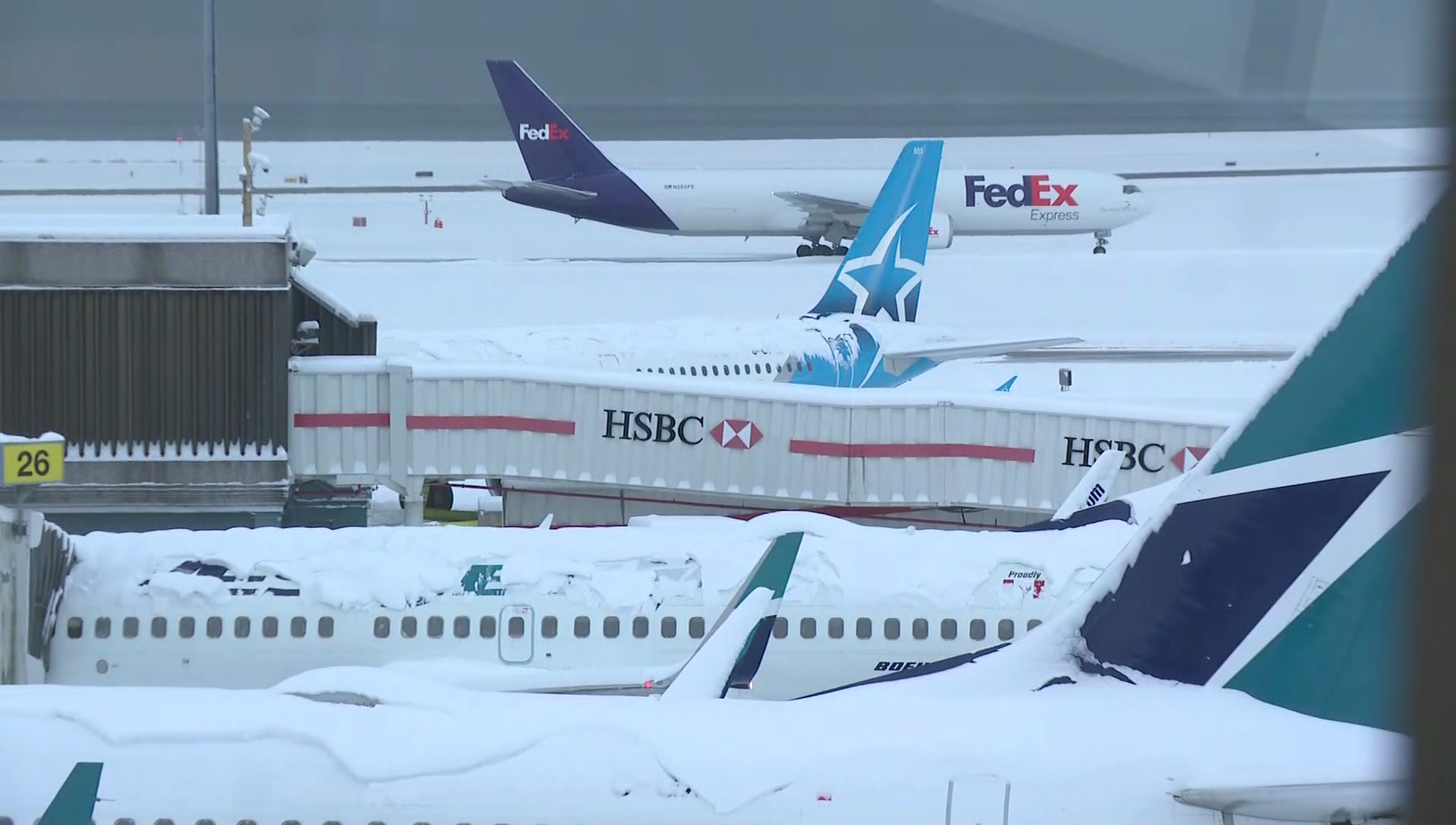 Planes at Vancouver International Airport on Tuesday, Dec. 20, 2022 following a major snow storm that brought operations to a halt