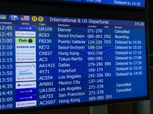 A display screen at Vancouver's YVR airport shows every upcoming flight either delayed or cancelled.