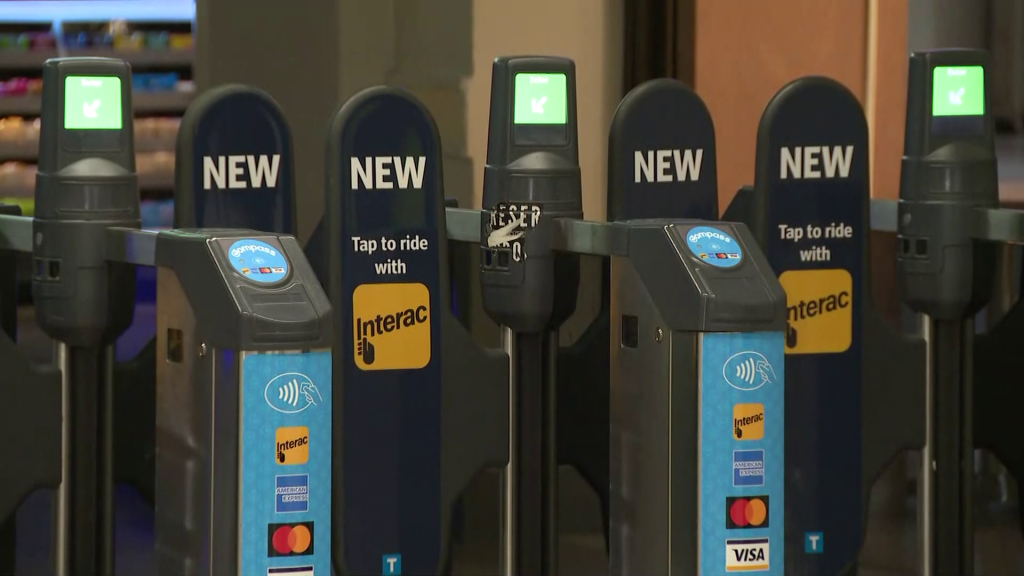 Translink Compass fare gate with Interac signs