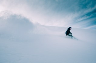 person skiing with lots of snow