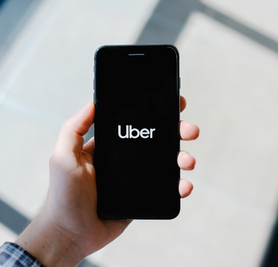 a cell phone with the word uber shown