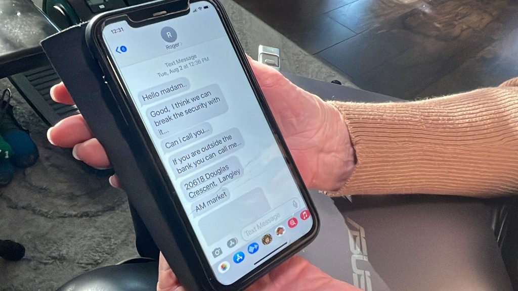 A cell phone is shown held by a senior citizen. The screen shows text messages being used to scam the woman.