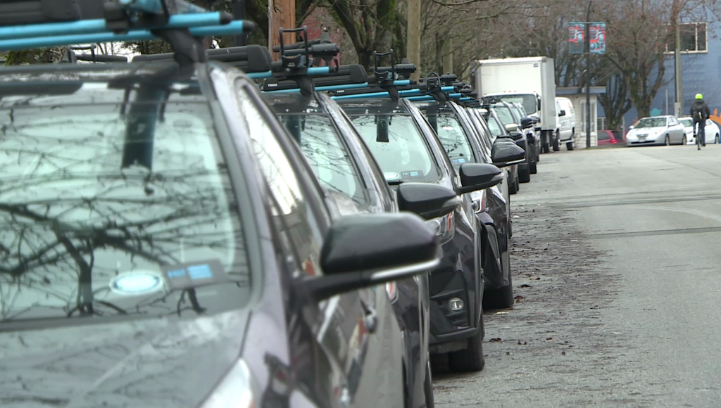 EVO vehciles parked in a row along a street in Vancouver