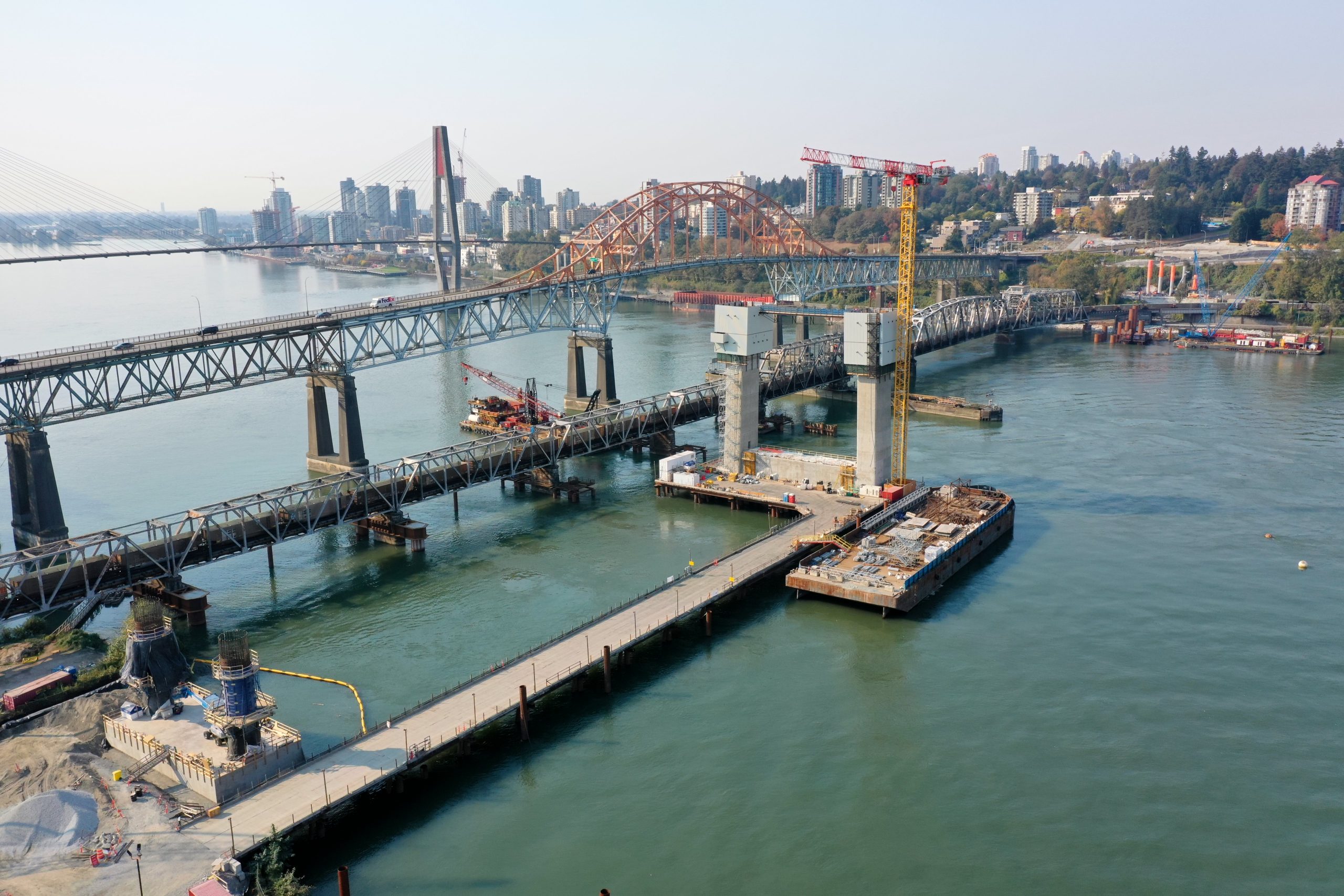 The new Pattullo Bridge is seen under construction from the air with the old bridge in the background