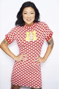 Comedian Margaret Cho wearing red and white shirt